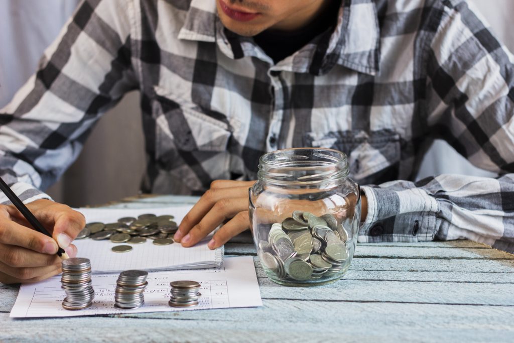 Jar with savings coins table